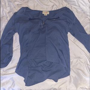 A blue 3 quarter sleeved shirt